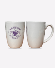 image: white coffee mug with purple image of berries surrounded by text reading LOGANBERRY BOOKS BERRY GOOD BOOKS
